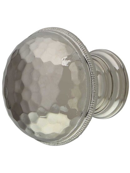 Atherton Hammered Surface Round Cabinet Knob with Knurled Edge - 1 1/4 inch Diameter in Polished Nickel.